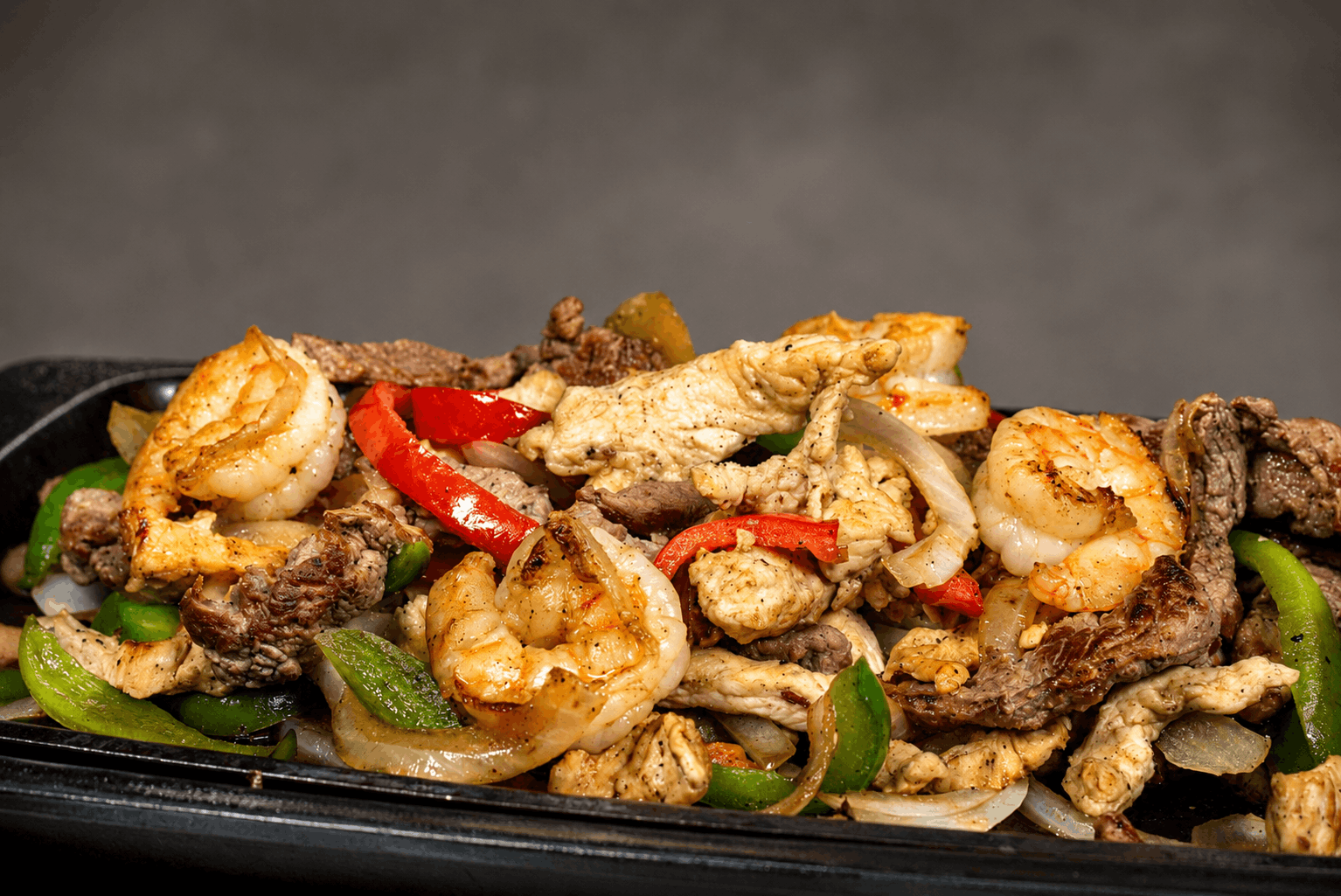 Sizzling fajita platter closeup